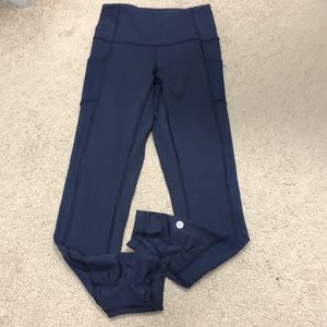 Lululemon size 4 Navy color leggings with mesh side panels and side pockets!